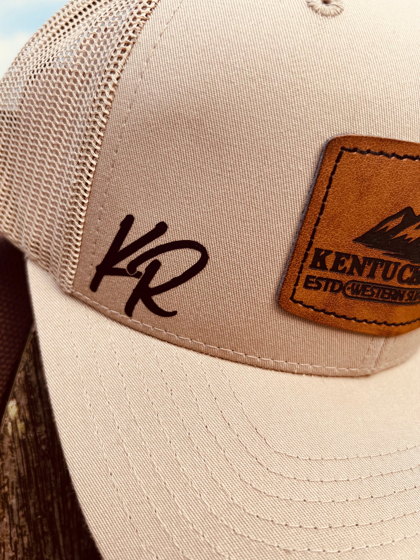 Beige cap with brown leather patch and 'KENTUCKY Ridge' text