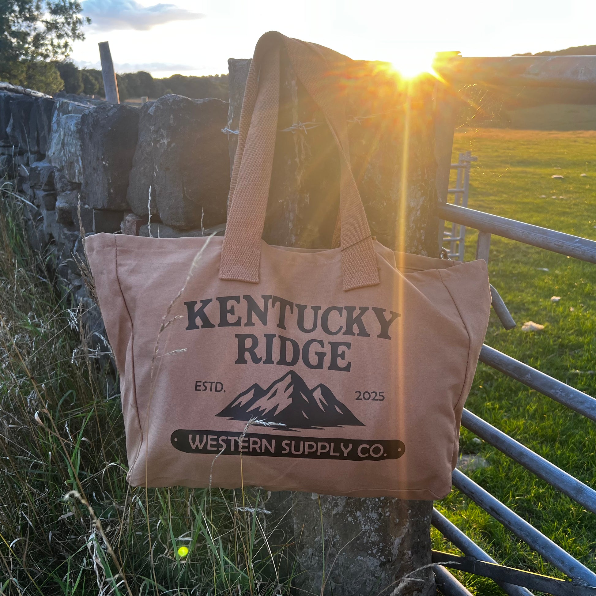 Kentucky Ride Tote Bag hung on a gate