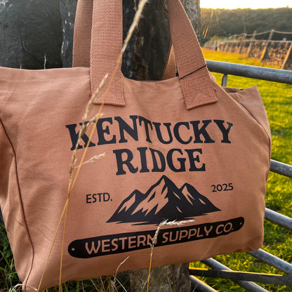 Brown tote bag with 'Kentucky Ridge' branding against a natural background